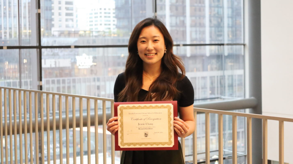 Jeanie Chang with the 2024 Research Excellence Award.